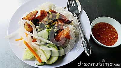Rice with Grilled Pork Chop and chili sauce Stock Photo