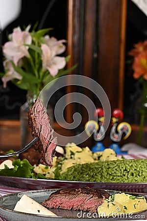 rice with herbs barbecue roast meat and potatoes cooked with olive oil and seasoning Stock Photo