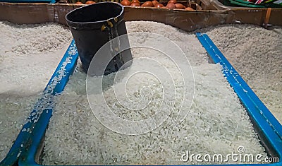 rice measuring device in the rice container at the market Stock Photo