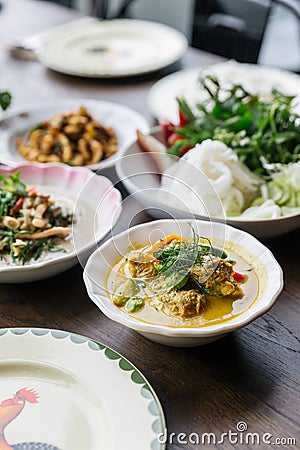 Rice Noodles with Crab Meat Curry Sauce, Served with vegetables. Classic Thai cuisine Stock Photo