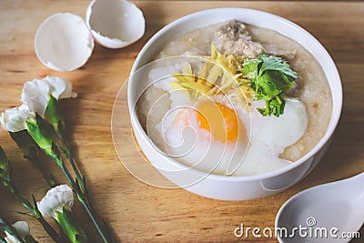 Rice porridge with ground pock vintage tone with white flowers o Stock Photo