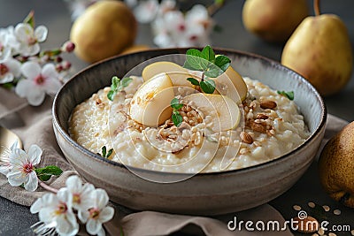 Rice porridge with pears, decorated with flowers Stock Photo