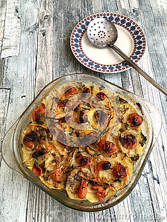 Rice potatoes and artichokes baked meal Stock Photo