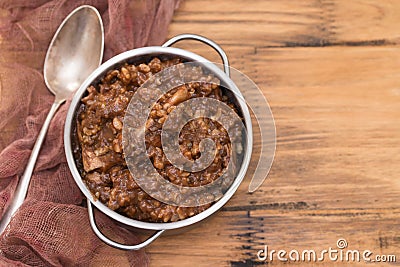 Rice with rabbit on dish on wooden background Stock Photo