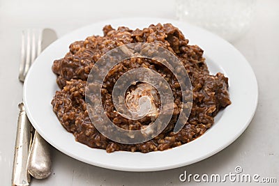 Rice with rabbit on dish on wooden background Stock Photo