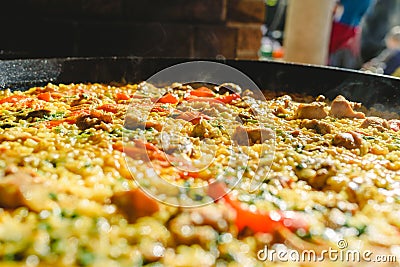 Rice and rabbit, typical dish of the gastronomy of the region of Murcia, Spain, cooked in a paella pan Stock Photo