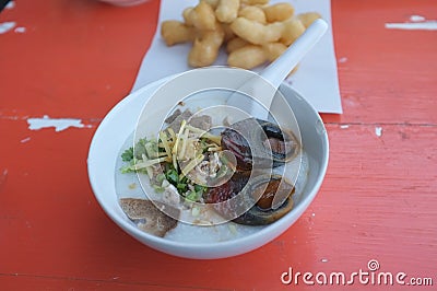 Rice soup or Congee minced pork and entrails with preserved egg Stock Photo
