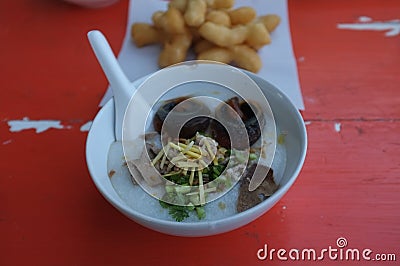 Rice soup or Congee minced pork and entrails with preserved egg Stock Photo