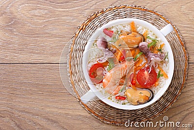 Rice soup with seafood on the table close-up top view Stock Photo