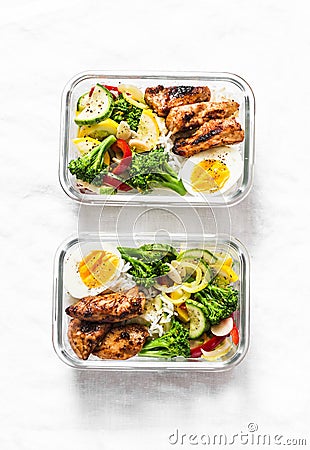 Rice, stewed vegetables, egg, teriyaki chicken - healthy balanced lunch box on a light background. Home food for office Stock Photo