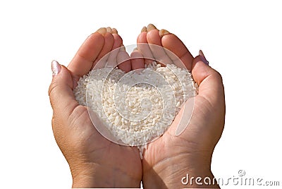 Rice in woman's hands. Stock Photo