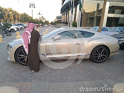 Rich Arab man , maybe seller, with nice car Editorial Stock Photo