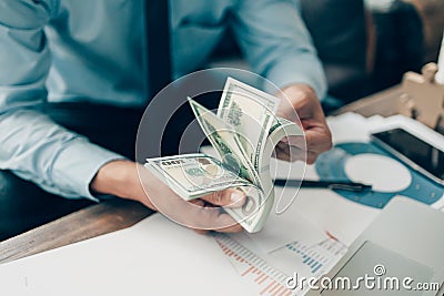 The rich businessman hands show the money American dollars Income and Business concept Stock Photo