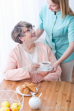 Rich elderly woman having care Stock Photo