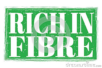 RICH IN FIBRE, words on green grungy stamp sign Stock Photo