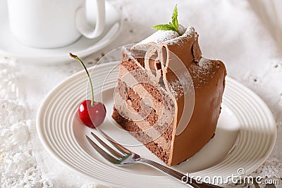 Rich piece of chocolate torte with a delicate cream close-up. ho Stock Photo