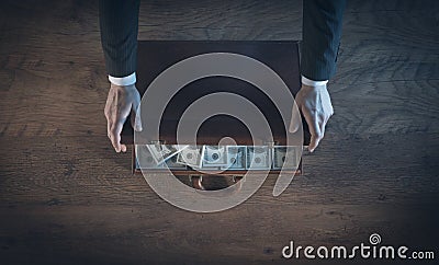 Rich vintage businessman with a lot of dollars Stock Photo