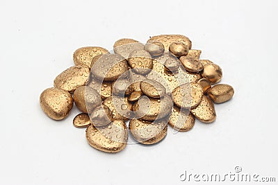 Gold Pebble contemplation of richness Stock Photo