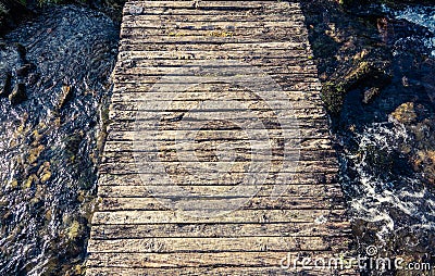 Rickety Footbridge Over Stream Stock Photo