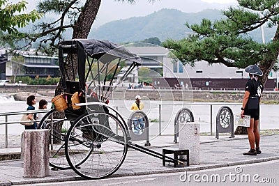 Rickshaw driver waiting for tourist in Kyoto Editorial Stock Photo