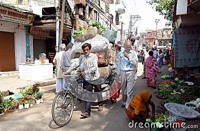 Rickshaw driver working on the street of Indian city Editorial Stock Photo