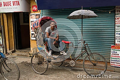 Rickshaw drivers work hard to make a living and are an important means of transportation in narrow streets Editorial Stock Photo