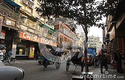 Rickshaw man pulls the customer, Kolkata Editorial Stock Photo