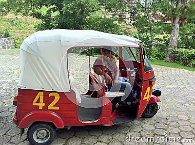 Rickshaw or Tuktuk and Driver Editorial Stock Photo