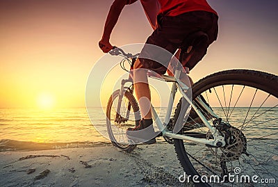 Ride on bike on the beach Stock Photo