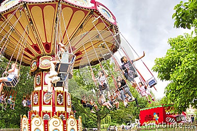 Ride Swing Carousel in motion in amusement park Editorial Stock Photo