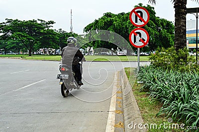 Rider going wrong way Editorial Stock Photo