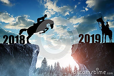 The rider on the horse jumping into the New Year 2019. Stock Photo