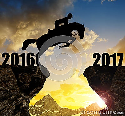 The rider on the horse jumping into the New Year 2017 Stock Photo