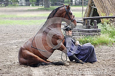 Rider and horse resting together Editorial Stock Photo