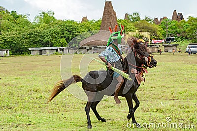 Rider on horse with spear at Pasola Festival, Kodi, Sumba Island, Nusa Tenggara Editorial Stock Photo