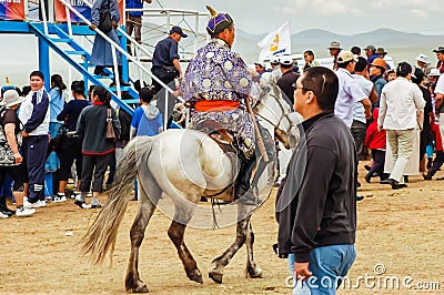 Rider in traditional Mongolian deel at Nadaam horse race Editorial Stock Photo