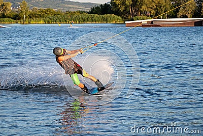 Rider wakeboarding in the cable wake park Merkur Editorial Stock Photo