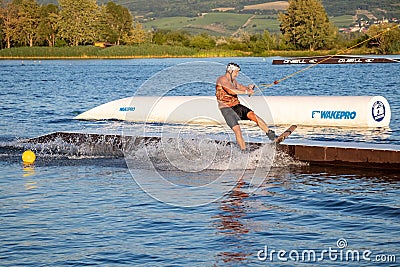 Rider wakeboarding in the cable wake park Merkur Editorial Stock Photo