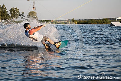 Rider wakeboarding in the cable wake park Merkur Editorial Stock Photo