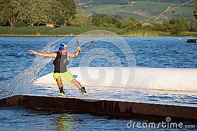 Rider wakeboarding in the cable wake park Merkur Editorial Stock Photo