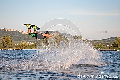 Rider wakeboarding in the cable wake park Merkur Editorial Stock Photo