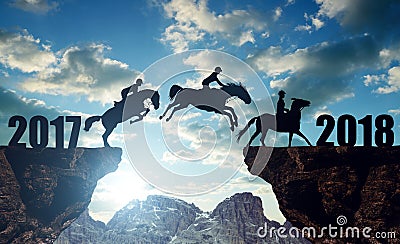 The riders on the horses jumping into the New Year 2018 Stock Photo