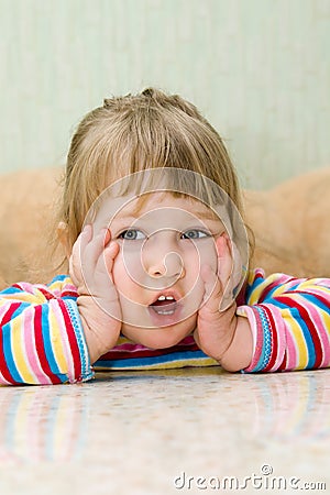 Ridiculous thinking little girl Stock Photo