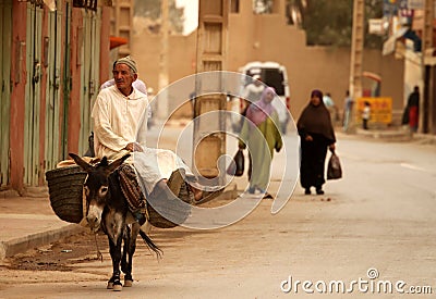 Riding a donkey Editorial Stock Photo