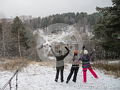 Riding on rope trolley Track in winter. People having fun together. Extreme and active lifestyle. Stock Photo