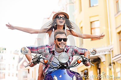 Riding scooter together. Stock Photo