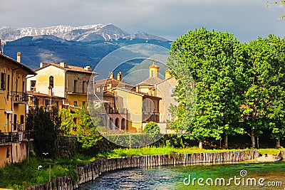 Rieti, city of central Italy. Fiume Velino with ancient houses and the Terminillo mountain at the top Stock Photo