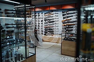 Rifle choice, showcase in gun shop, nobody Stock Photo