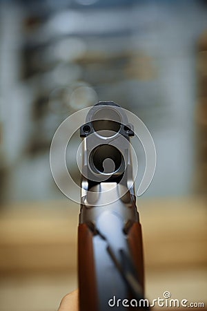 Rifle in gun shop, closeup view through the barrel Stock Photo