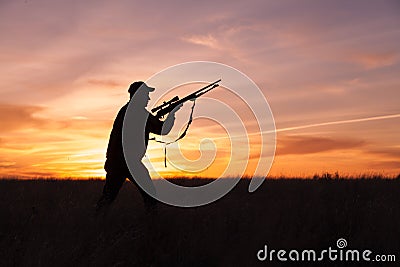 Rifle Hunter Ready at Sunset Stock Photo